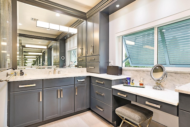 bathroom with vanity, beam ceiling, and backsplash