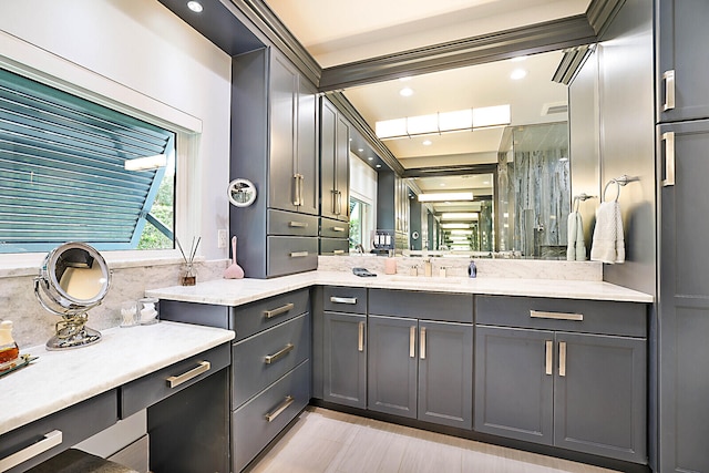 bathroom with vanity and backsplash