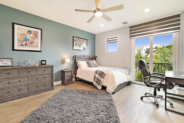 bedroom featuring ceiling fan and light hardwood / wood-style floors