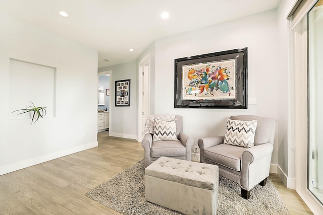 sitting room with light hardwood / wood-style floors