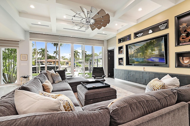 living room featuring beam ceiling, ceiling fan, and coffered ceiling