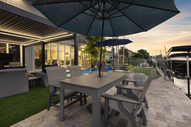 view of patio terrace at dusk