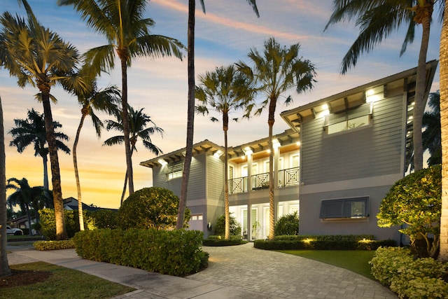 view of outdoor building at dusk