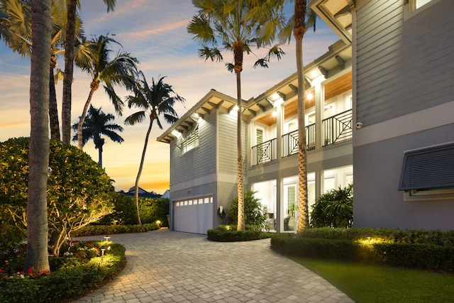 outdoor building at dusk with a garage