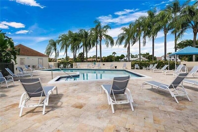 view of swimming pool featuring a patio area