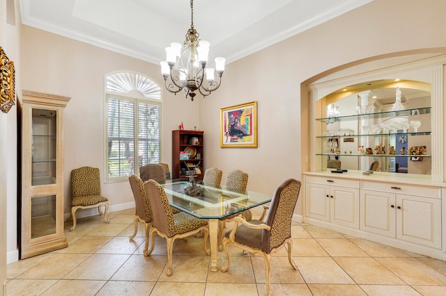 dining room featuring an inviting chandelier, light tile patterned floors, and ornamental molding