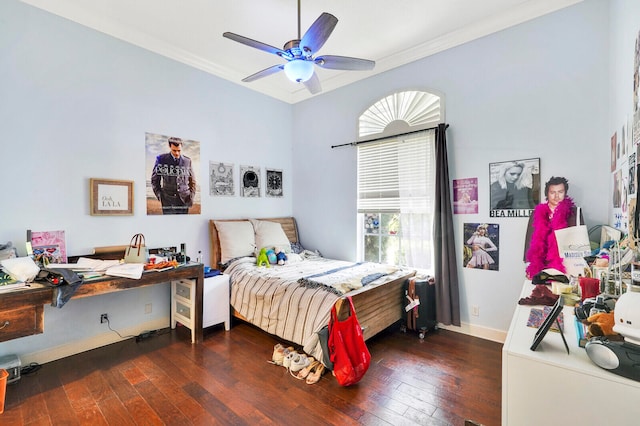 bedroom with ceiling fan, dark wood-type flooring, and ornamental molding