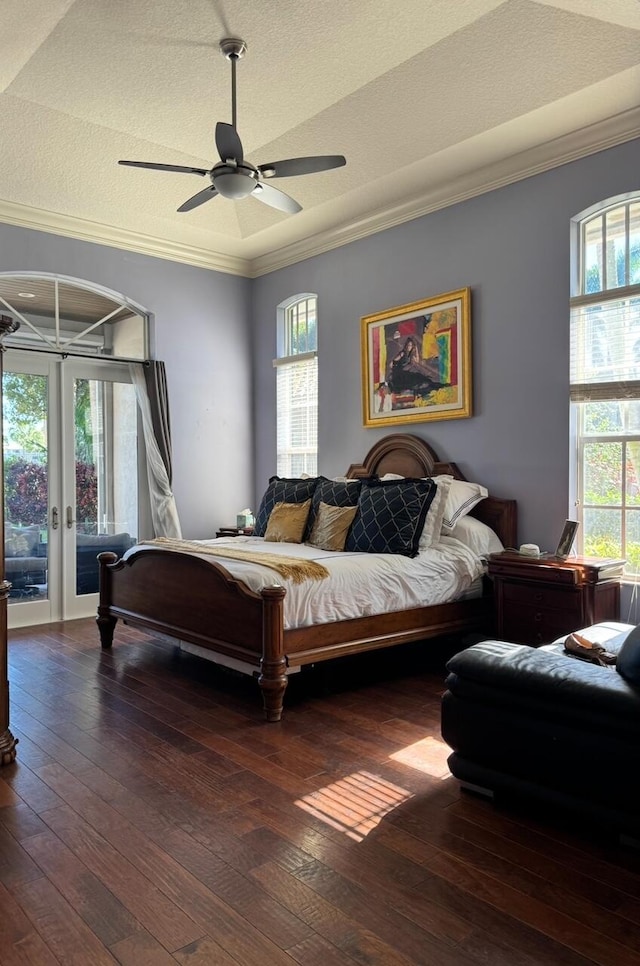 bedroom with multiple windows, access to outside, and ceiling fan