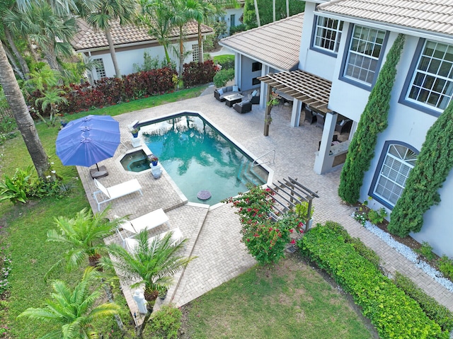 view of swimming pool featuring a patio area, a pergola, and an in ground hot tub