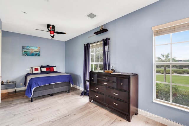 bedroom featuring light wood-type flooring and ceiling fan