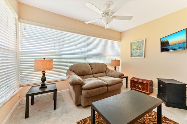 tiled living room featuring ceiling fan