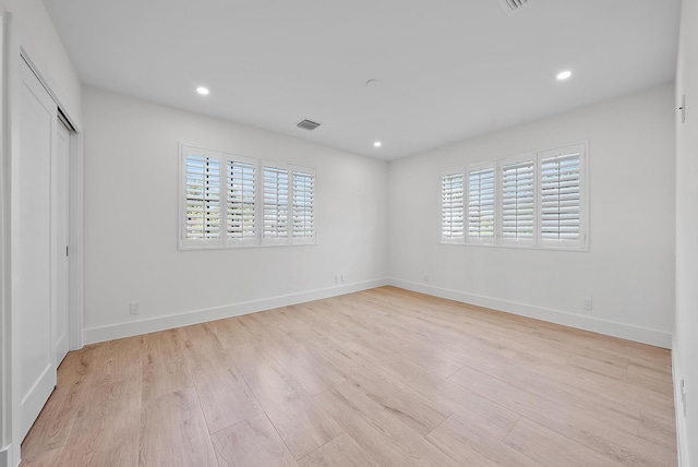 empty room with light wood-type flooring