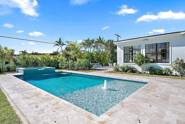 view of swimming pool with an in ground hot tub, a patio, and pool water feature