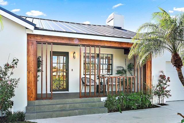 doorway to property featuring a porch