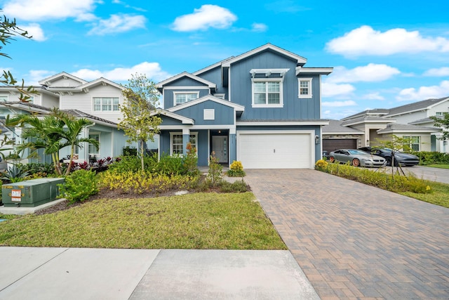 craftsman inspired home with a front lawn and a garage