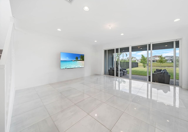 unfurnished living room with light tile patterned flooring