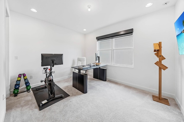 workout room with light colored carpet