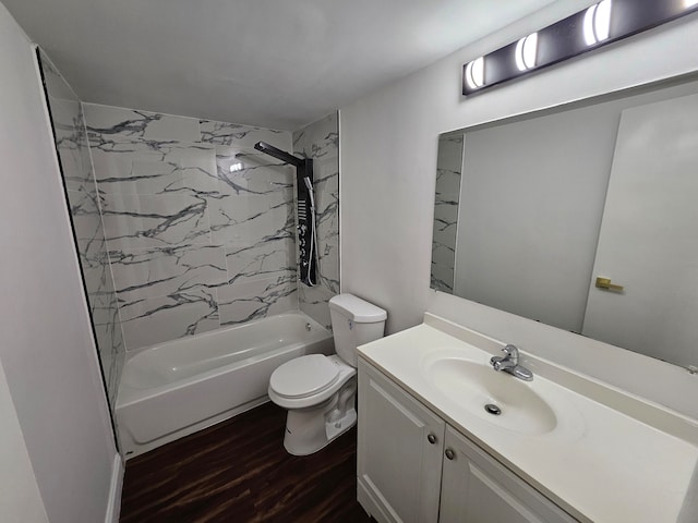 full bathroom featuring tiled shower / bath combo, toilet, wood-type flooring, and vanity