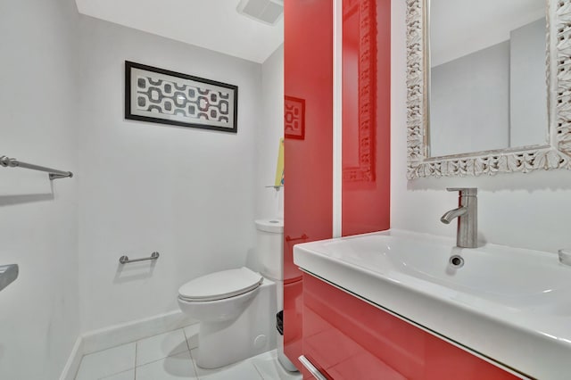 bathroom featuring tile patterned flooring, vanity, and toilet