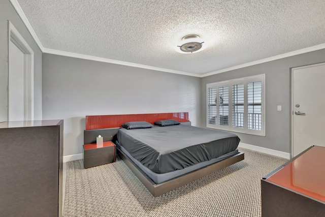 bedroom featuring carpet flooring, a textured ceiling, and ornamental molding