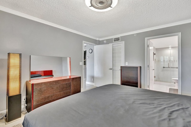 bedroom with ensuite bathroom, crown molding, and a textured ceiling