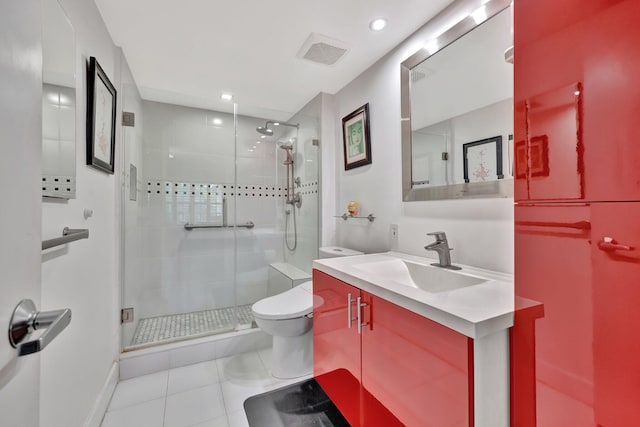 bathroom with toilet, vanity, tile patterned floors, and walk in shower