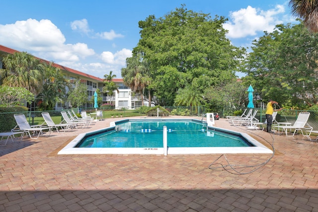 view of swimming pool featuring a patio area