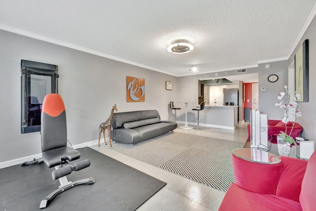 workout area with a textured ceiling and ornamental molding