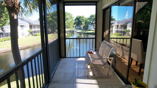 sunroom with a water view