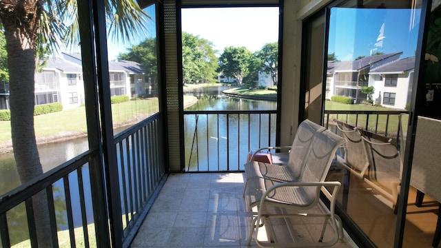 sunroom with a water view