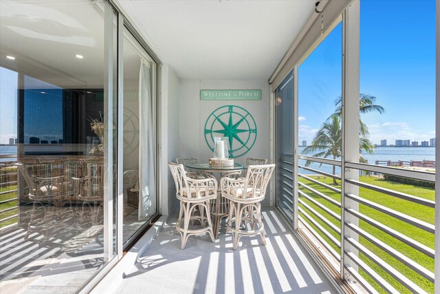 sunroom with a water view