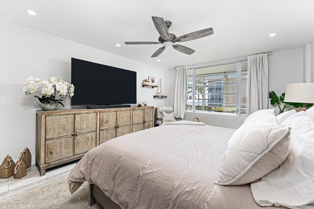 bedroom featuring ceiling fan and light hardwood / wood-style flooring