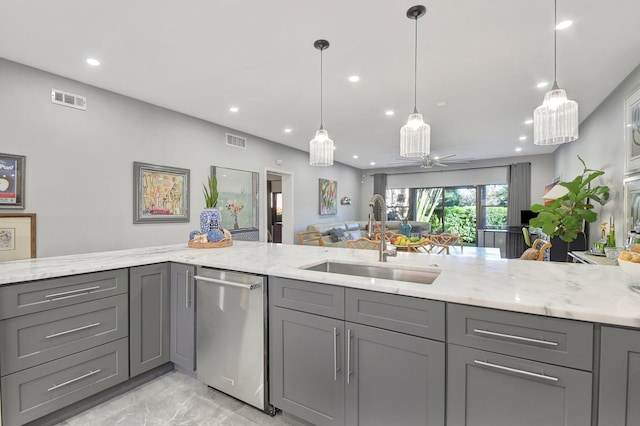 kitchen with gray cabinetry, ceiling fan, sink, and stainless steel dishwasher