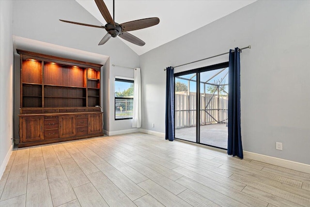 unfurnished living room featuring light hardwood / wood-style floors, vaulted ceiling, and ceiling fan