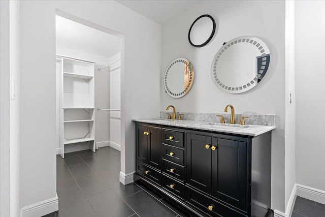 bathroom featuring tile patterned flooring and vanity