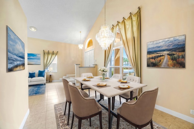 dining room featuring a healthy amount of sunlight, a notable chandelier, baseboards, and light tile patterned flooring