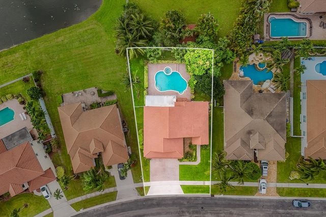 birds eye view of property with a residential view