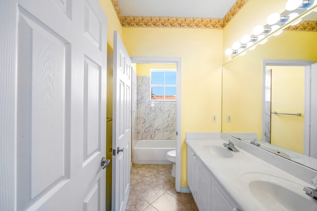 bathroom featuring a sink, toilet, and double vanity