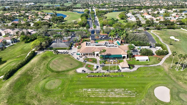 bird's eye view with view of golf course and a residential view