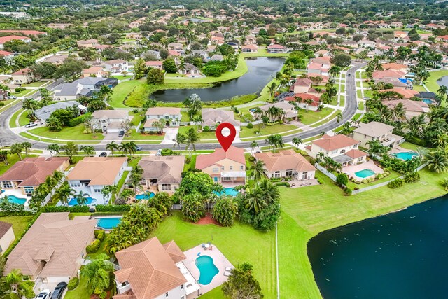 bird's eye view with a water view and a residential view