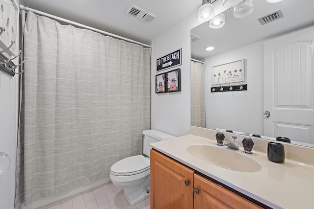 bathroom with tile patterned floors, vanity, and toilet