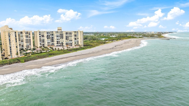 birds eye view of property featuring a view of the beach and a water view