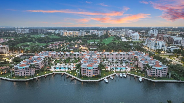 aerial view at dusk with a water view