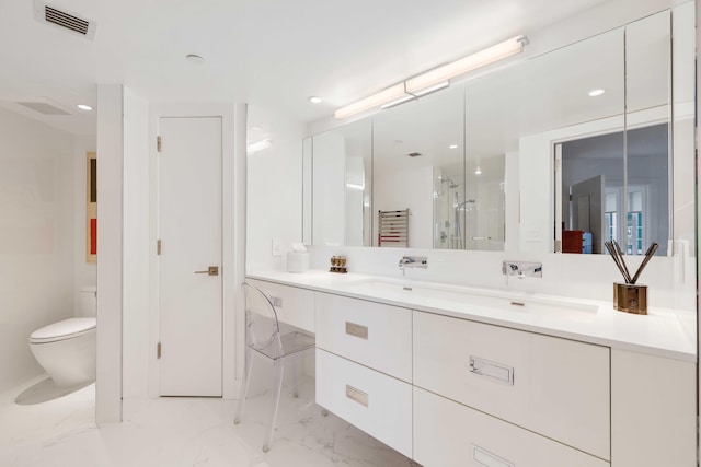 bathroom featuring vanity, toilet, radiator, and a shower with shower door