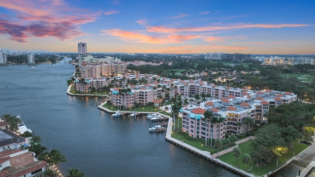 aerial view at dusk with a water view