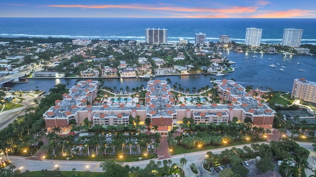 aerial view at dusk with a water view