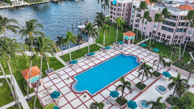 view of swimming pool featuring a water view