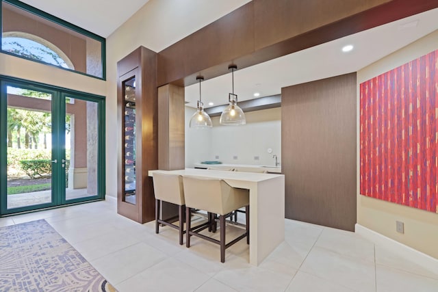 interior space with light tile patterned floors and sink