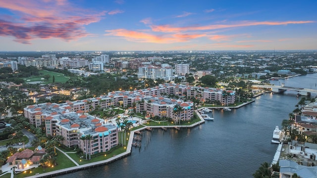 aerial view at dusk with a water view