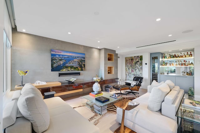 living room with a fireplace and light hardwood / wood-style floors